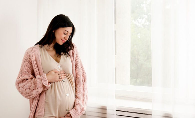 Pregnant Woman Smiling.jpg