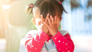 Cute Asian Baby Girl Closing Her Face And Playing Peekaboo Or Hide And Seek 1128821974 1258x839.jpeg