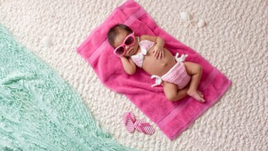 Newborn Baby Girl Wearing A Bikini And Sunglasses 506400520 1258x837.jpeg