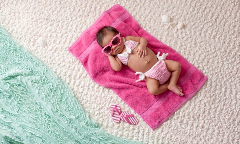 Newborn Baby Girl Wearing A Bikini And Sunglasses 506400520 1258x837.jpeg