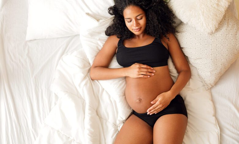 Pregnant Woman Laying In Bed 1440x1037.jpg